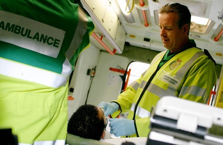 Paramedic with patient in an ambulance